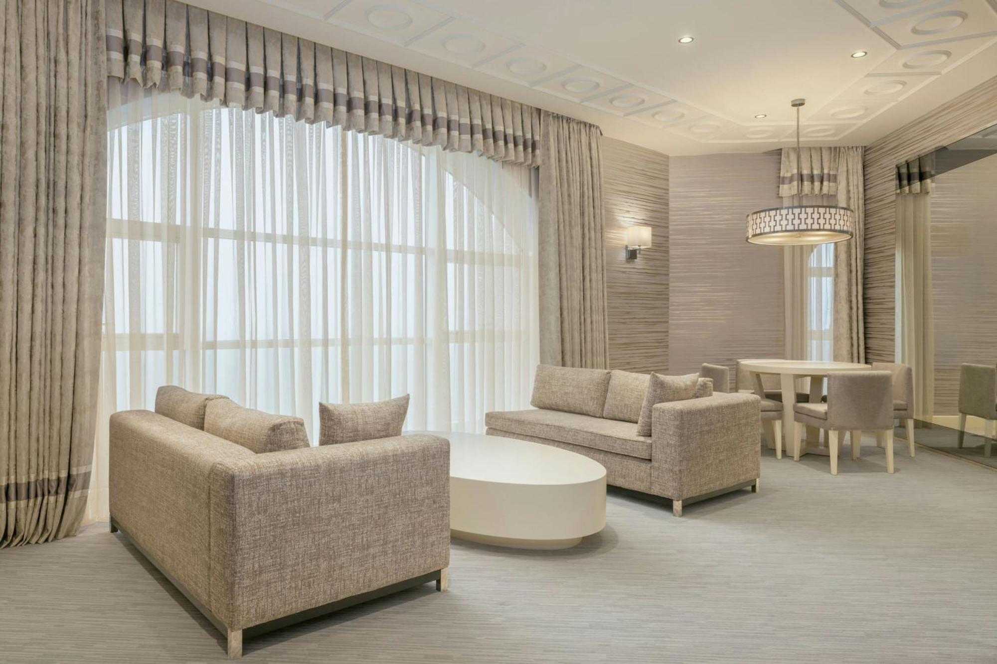 Sheraton Batumi Hotel Kültér fotó A living room with a large window